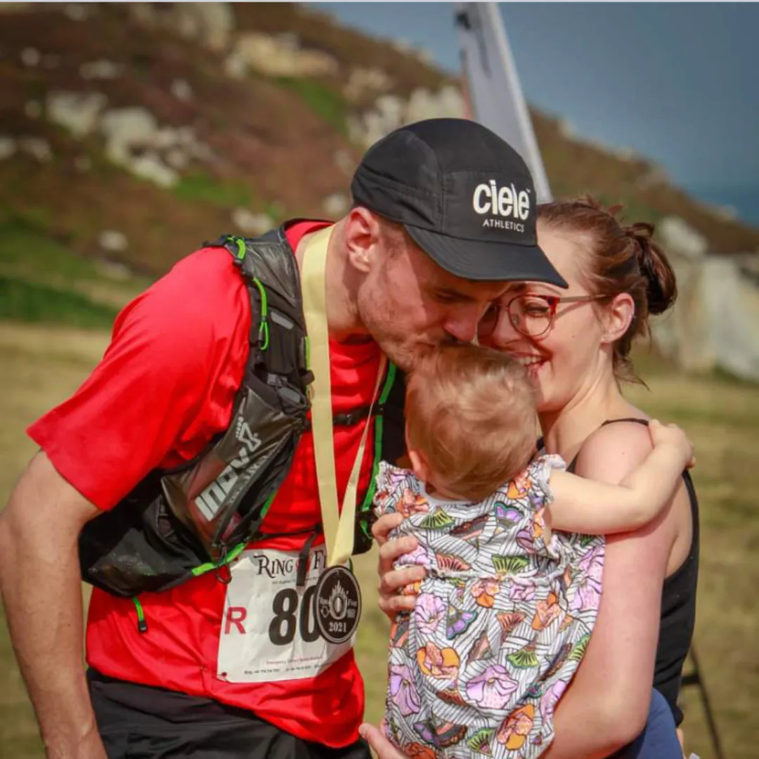 Sam with his family after a race